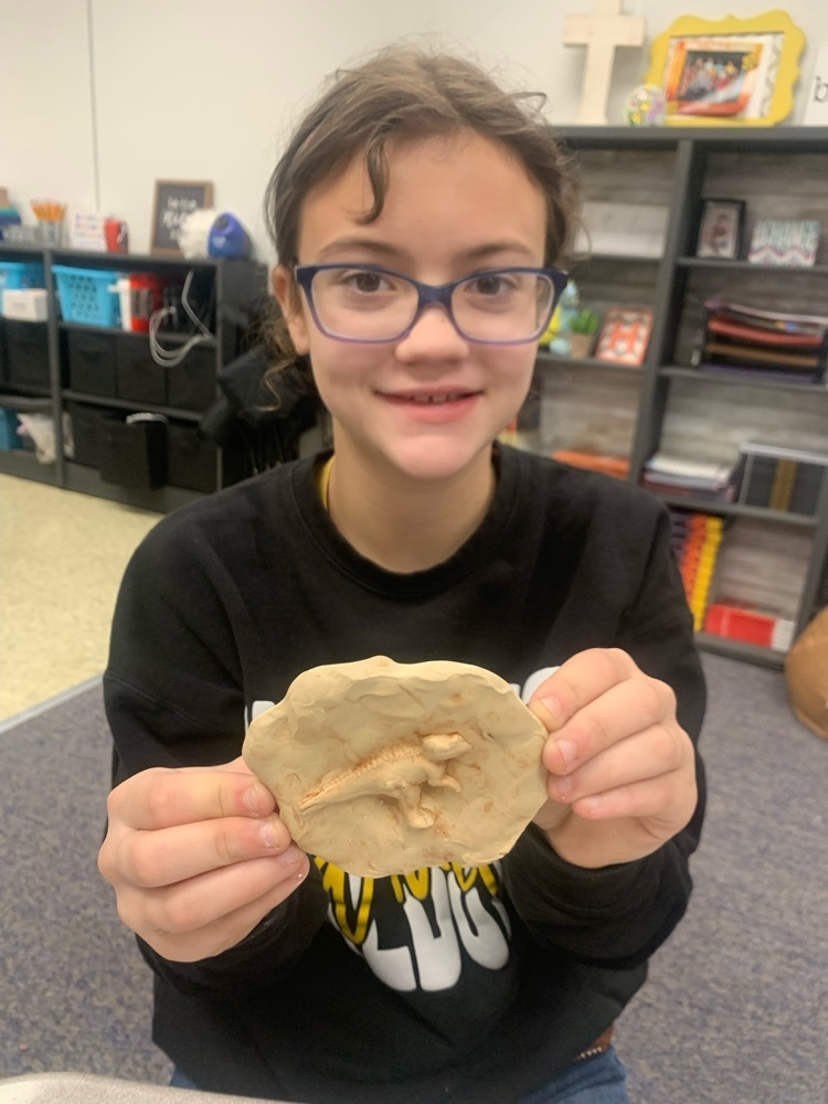 4th grader, Carlie Dowler with her fossil. 
