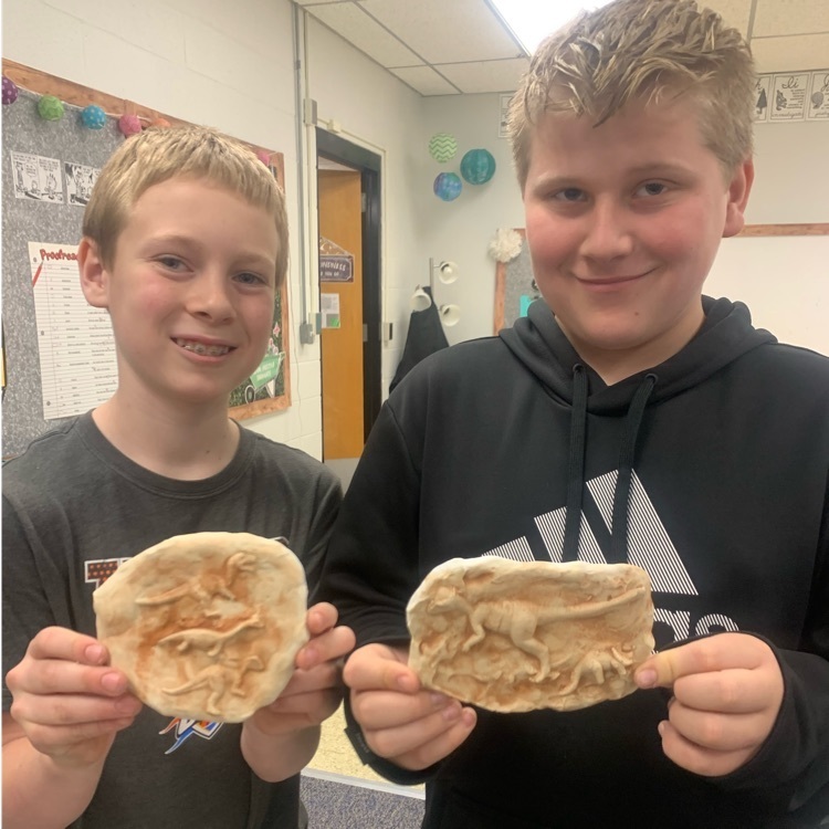 4th graders, Sabe & Noah with their dinosaur fossils. 