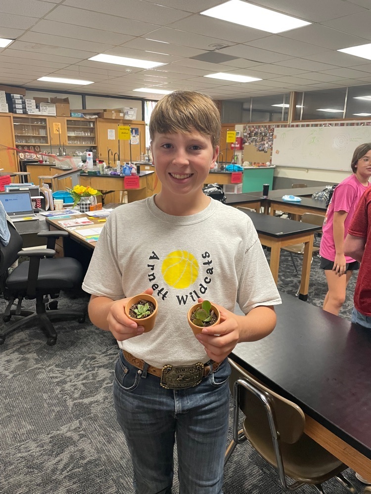 Bayne Strick holding two of his propagated succulents from the first section of Horticulture! 