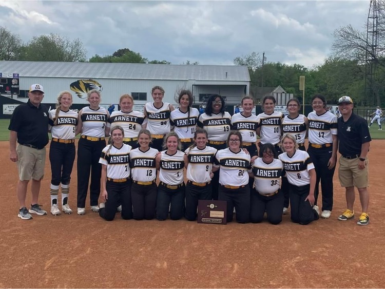 Coach Scot Friesen, Coach Ross Royal and the Lady Wildcats after winning the regional championship game! 